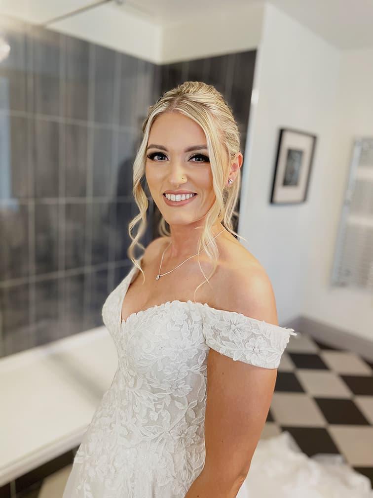 bride in weddding dress with makeup on