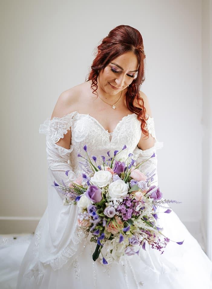 bride in wedding dress with bouquet